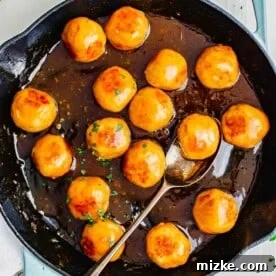 Hot honey chicken meatballs glazed and garnished